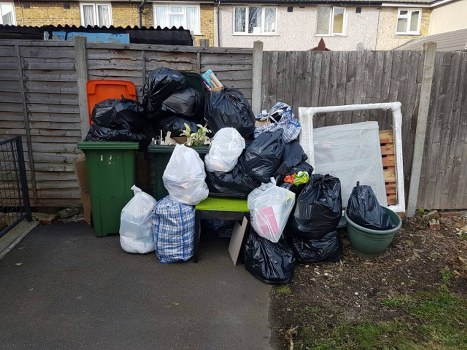 Old bed ready for disposal in Southall