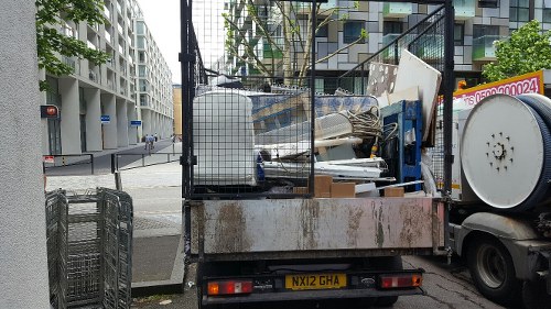 Professional team removing a bulky bed from a Blackheath home