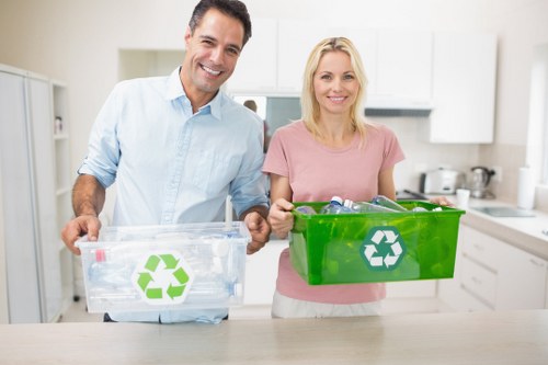 Professional disposal service handling a bed